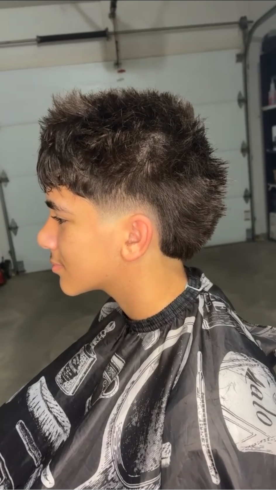 Sharp burst fade with textured hair
